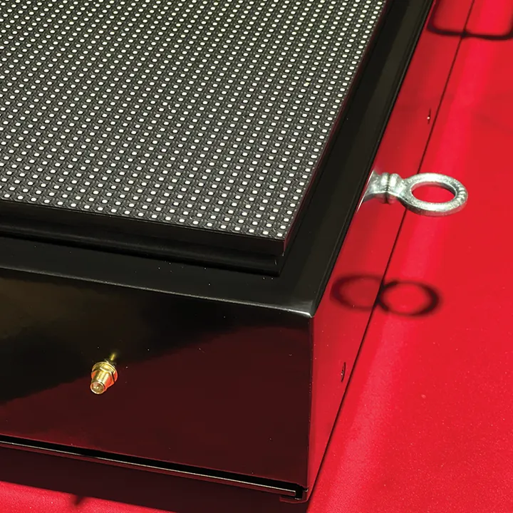 Close-up of an eye hook on top of the case and the wifi antenna connector